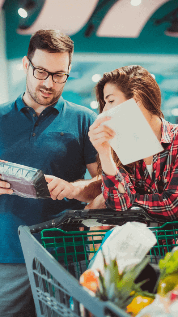 a couple shopping analyzing groceries at the store