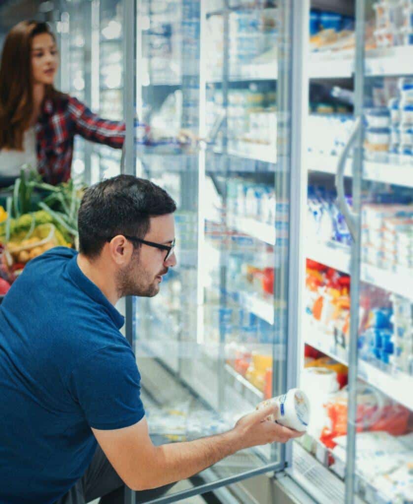 consumer on dairy aisle