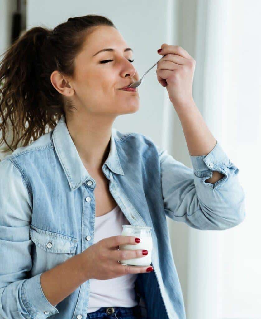 woman eating yoghurt