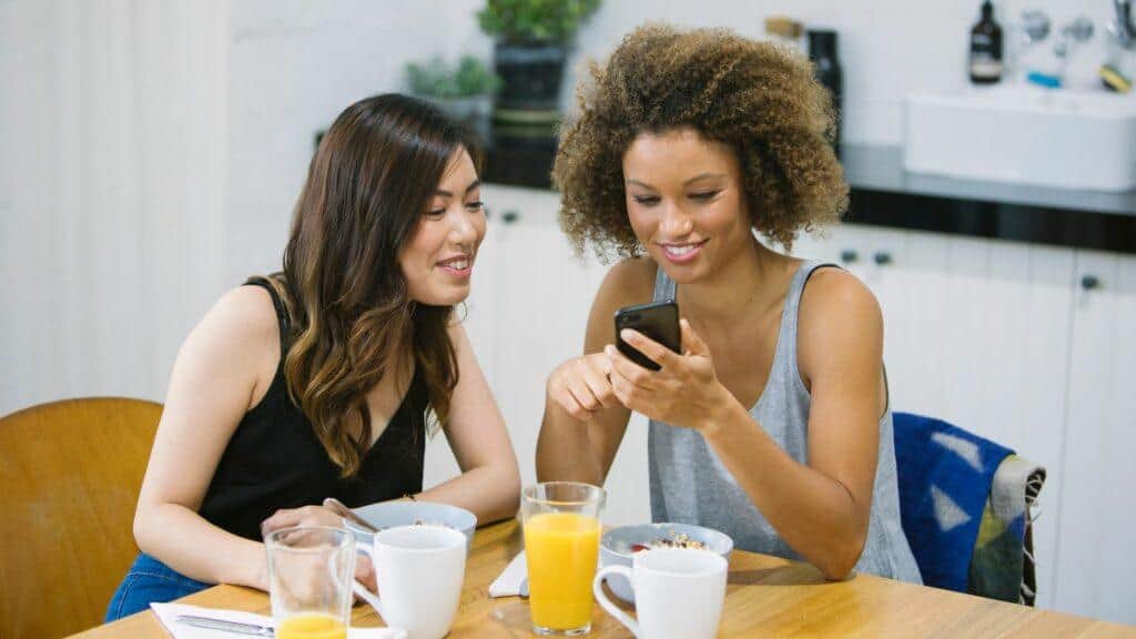 two professionals checking trends
