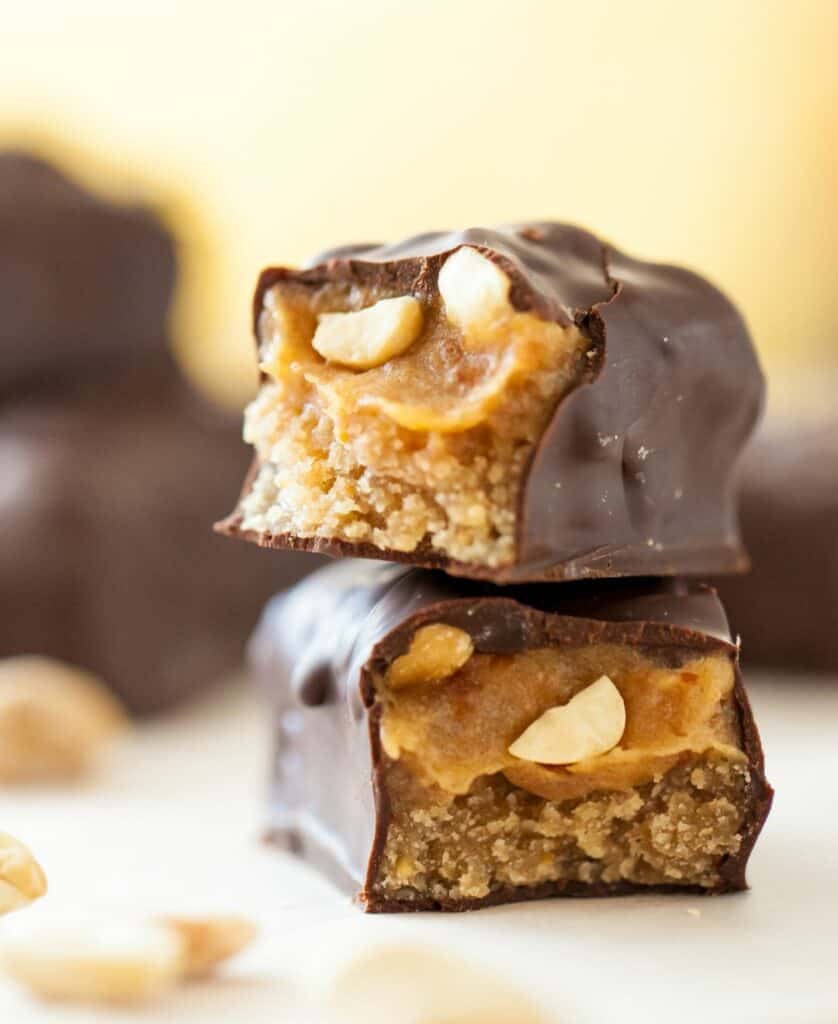 caramel nougat and nuts with chocolate bar cut in half