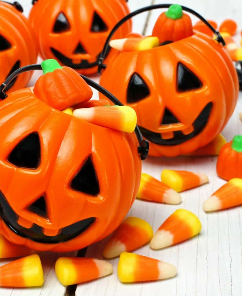 trick-or-treat halloween candy corn in pumpkin baskets