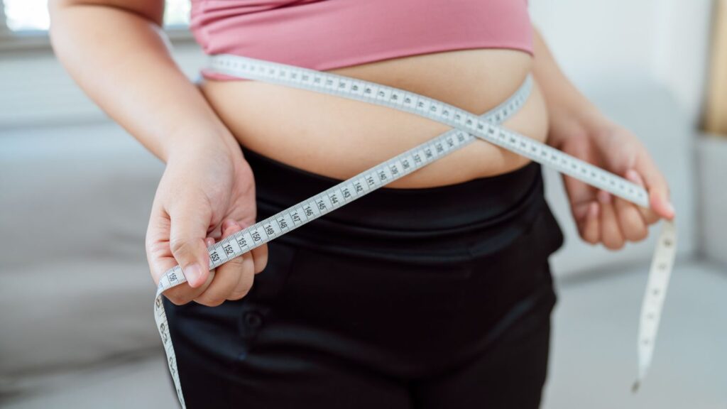 woman-measuring-her-belly